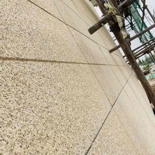 鹤壁 黄金麻花岗岩荔枝面外墙干挂石材效果示例